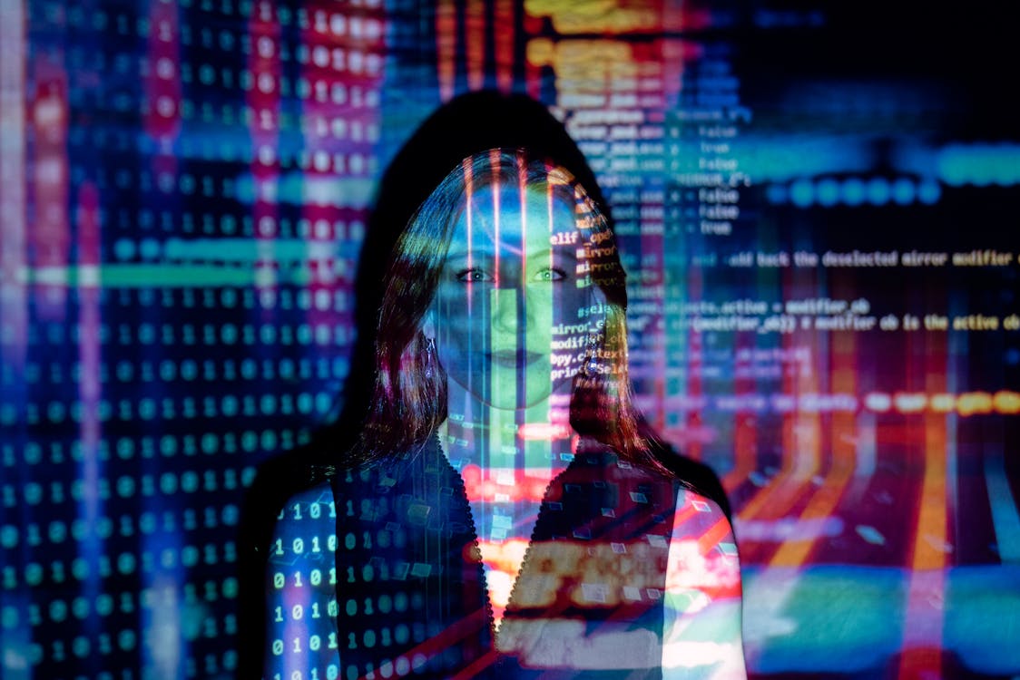 Woman with digital code projected over her face